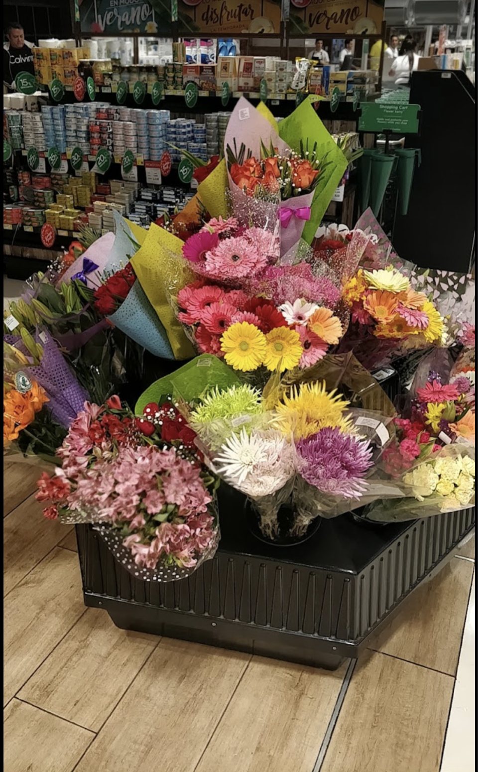 Fresh flower bouquets on display inside Auto Mercado in Herradura