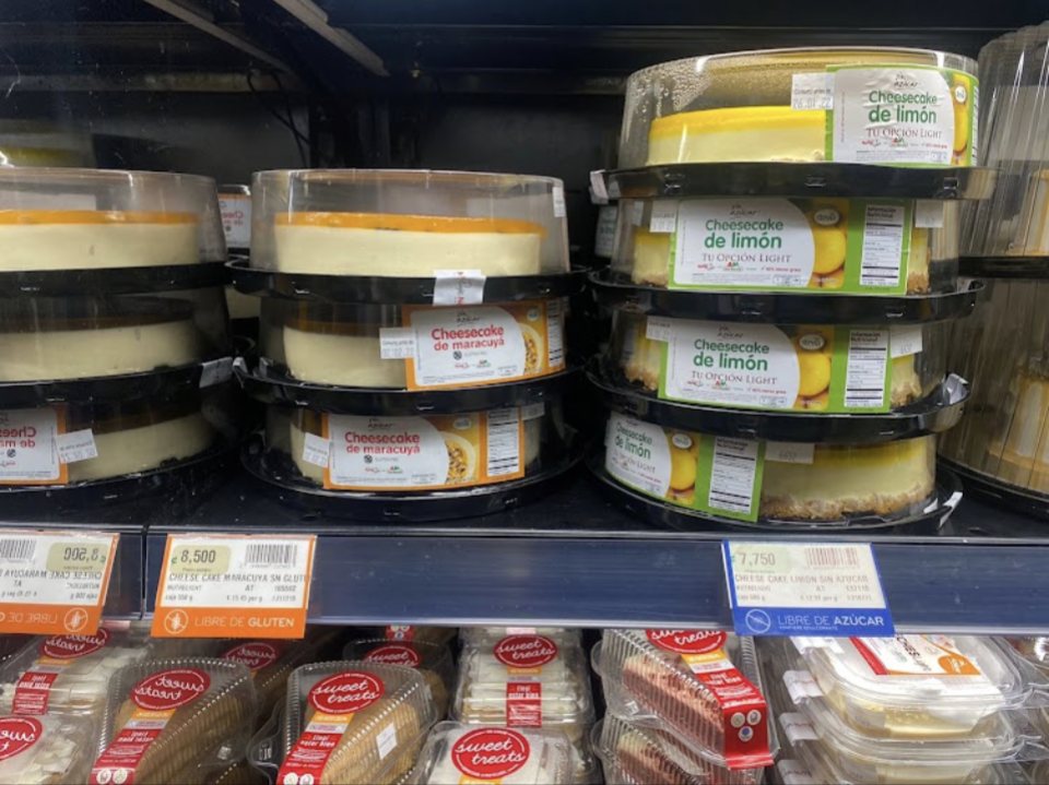 Fresh deli hummus and dips in the refrigerated case at Auto Mercado in Herradura