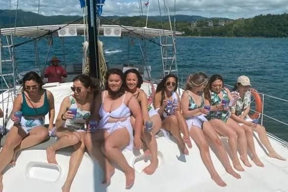 best bachelorette parties Jaco Beach Costa Rica — bachelorette group on sailing catamaran with drinks