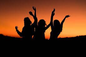 bachelorette party Jaco Beach Costa Rica — bachelorette group dancing at sunset