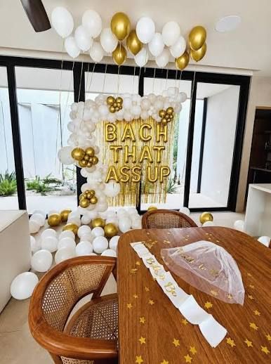 bachelorette party Jaco Beach Costa Rica — villa decorated with gold balloons and bridal party setup