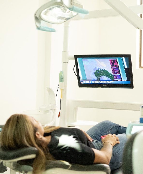 Patient receiving treatment in a modern operatory at Garabito Dental in Costa Rica