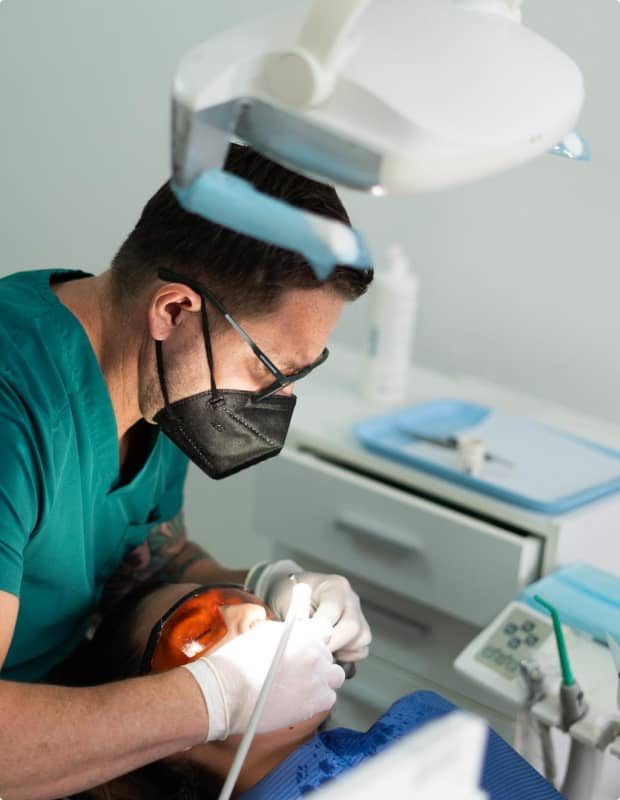 Dentist performing a detailed procedure at Garabito Dental in Costa Rica