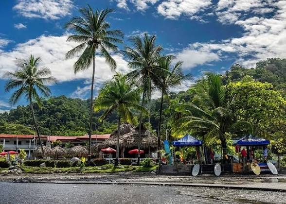 Beach with Tiki huts at Private Resort — VIP Wedding Venue Jacó Beach Costa Rica