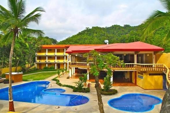 Aerial view of Private Resort compound with dual pools — South End Jacó Beach