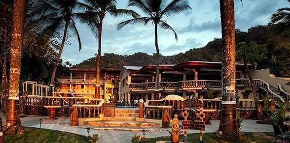Private Resort at dusk lit by palm lights — VIP Wedding Venue South End Jacó Beach