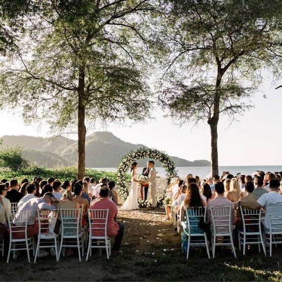 wedding planner Jaco Beach — large wedding ceremony circle arch with ocean backdrop, best venues Jacó Beach