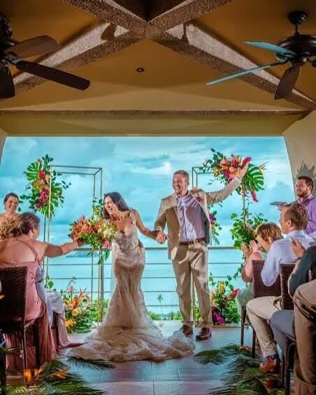 Destination wedding planning Jacó Beach Costa Rica — couple at ocean-view ceremony