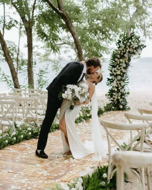 wedding planner Jaco Beach — couple first kiss at symbolic beachfront wedding ceremony Costa Rica