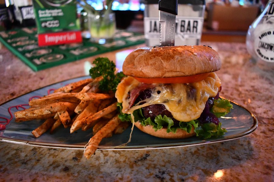 Gourmet burger and fries at Jaco Bar