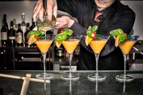 Bartender mixing signature cocktails for an open bar wedding Jaco Beach Costa Rica