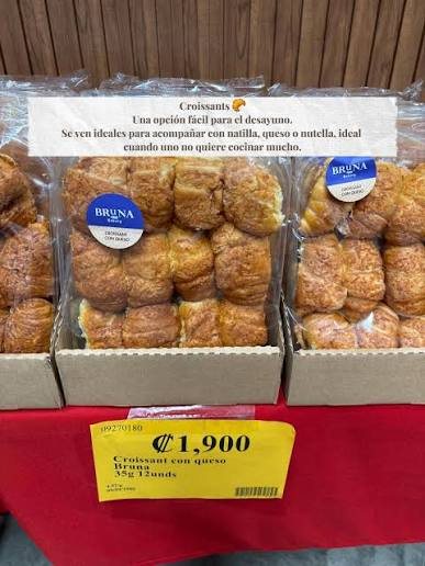 Fresh-baked cheese croissants in the bakery section at Pequeño Mundo in Herradura
