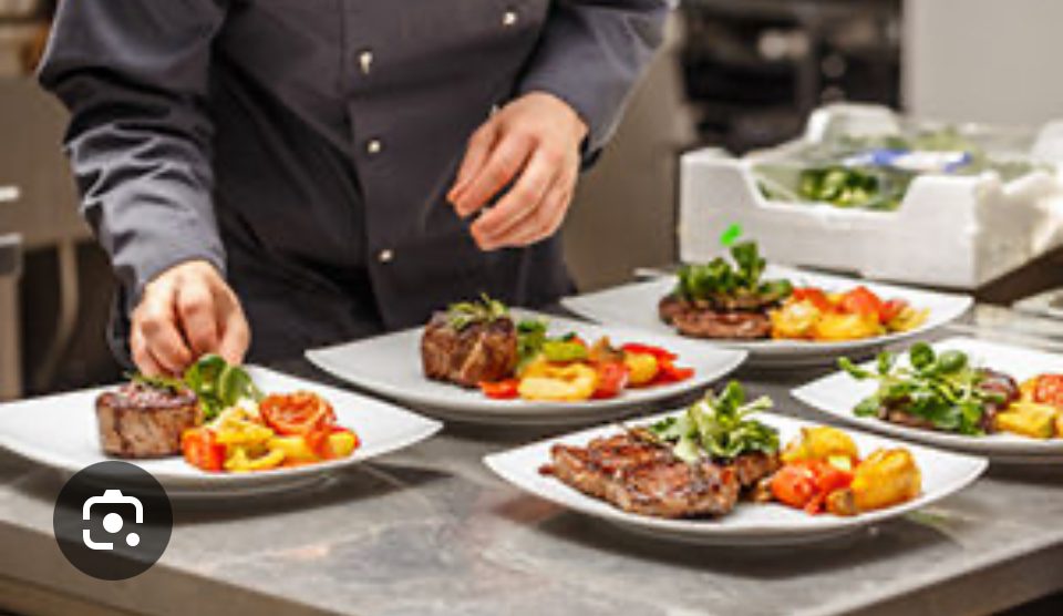 A private chef plating a dish for a bachelor party in Jaco