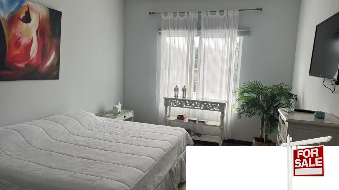 Living area modern home Residencial Bambú Punta Leona near Jaco — open-concept layout, fully titled, Punta Leona real estate