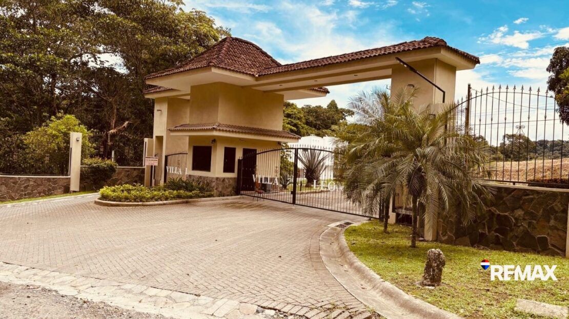 Lot view at Villa Leona gated community near Punta Leona — paved roads, water and electricity at lot, 24/7 security, Jaco Beach real estate