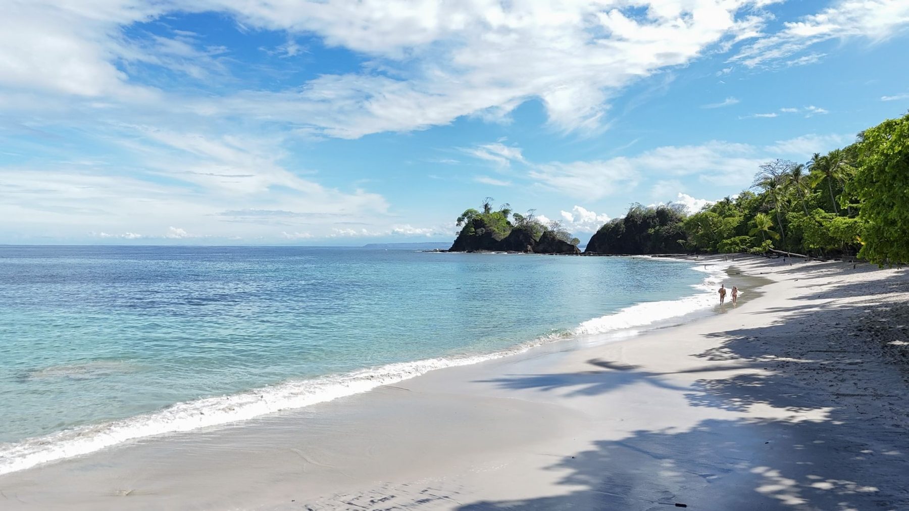 White-sand beach with calm, clear water at Playa Blanca in Punta Leona