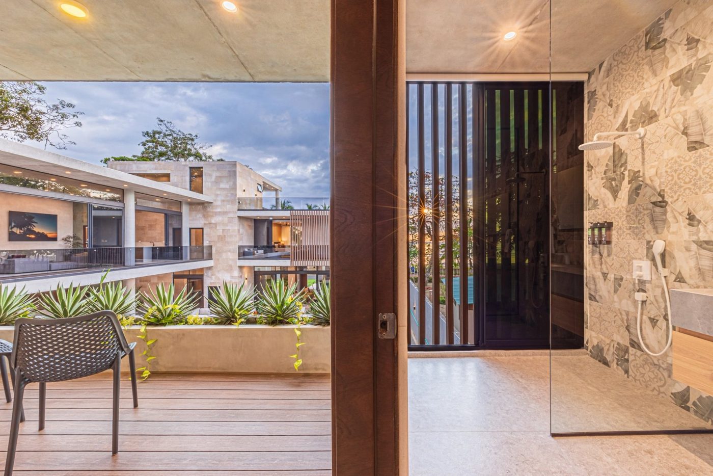 Casa VIP 1 luxury beachfront villa in Jacó — floor-to-ceiling glass doors onto the pool