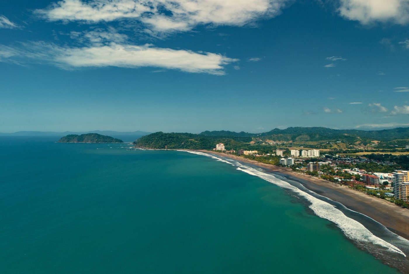 Casa VIP 1 luxury beachfront villa in Jacó — aerial view of Jacó Beach coastline