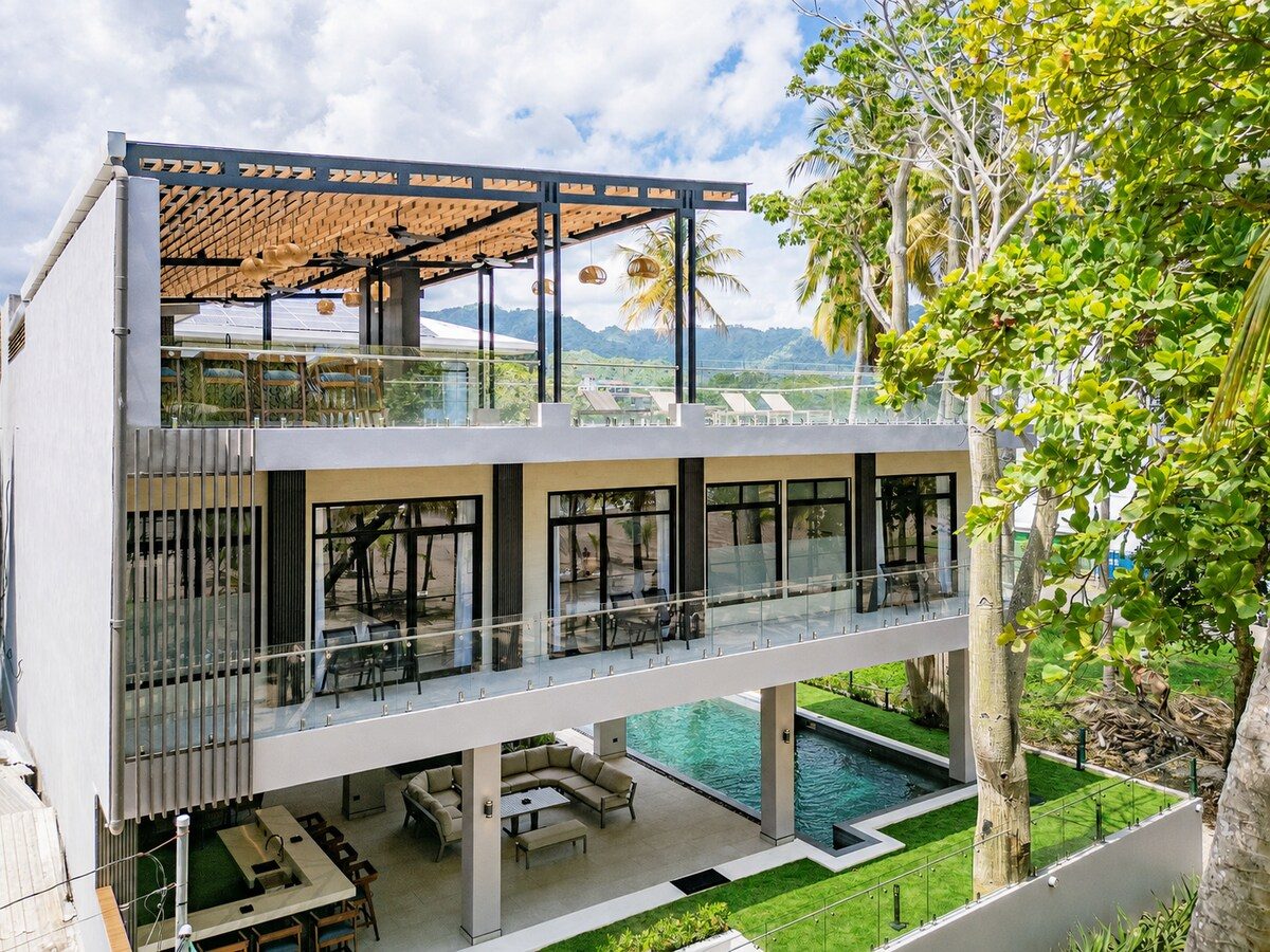 Casa VIP 2 — 15-bedroom beachfront estate in Jacó Beach, aerial view of the beachfront estate, pool and ocean