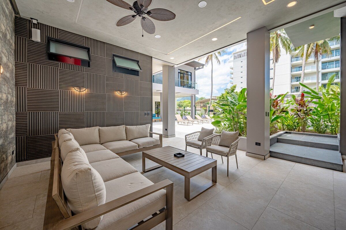 Casa VIP 2 — 15-bedroom beachfront estate in Jacó Beach, pool with stone waterfall wall