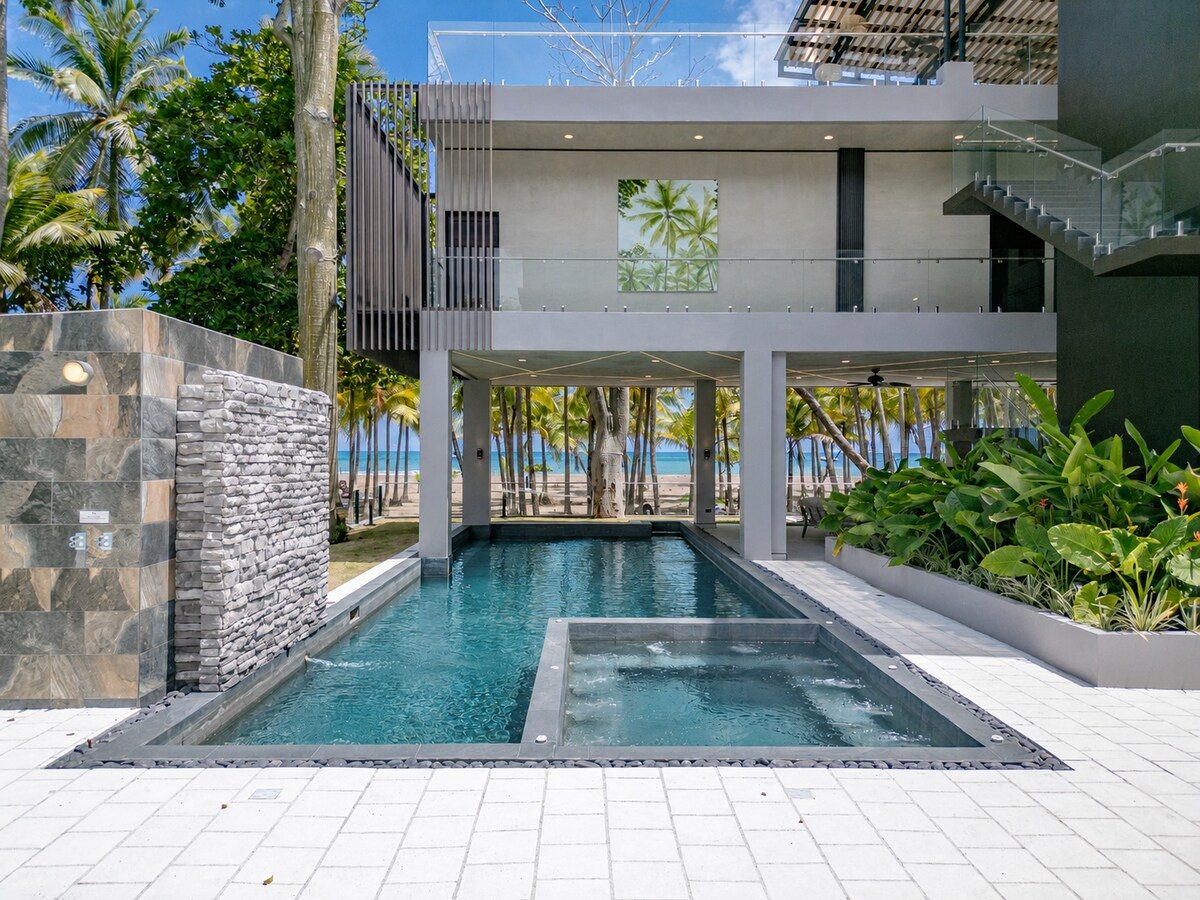 Casa VIP 2 — 15-bedroom beachfront estate in Jacó Beach, poolside patio and loungers