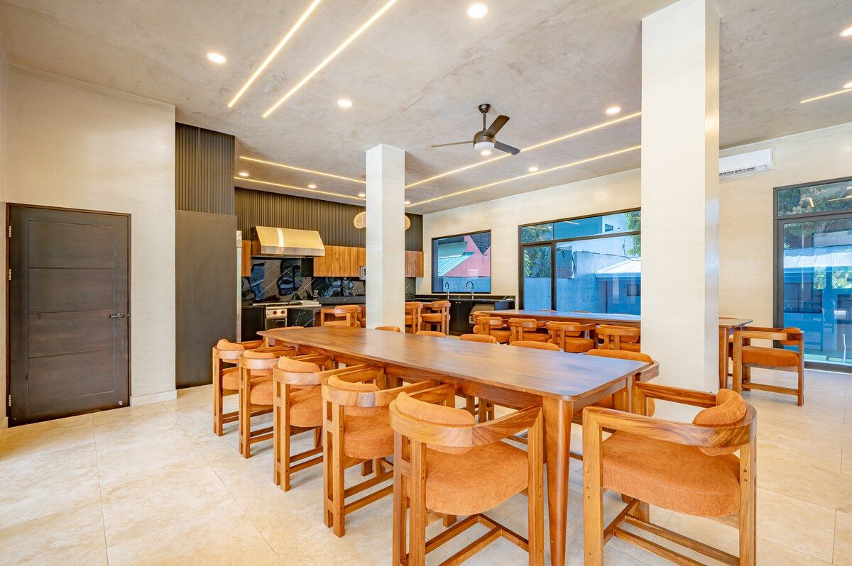 Casa VIP 2 — 15-bedroom beachfront estate in Jacó Beach, open-plan living room with oversized sectional