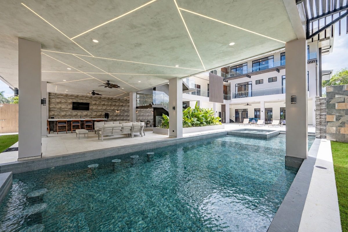 Casa VIP 2 — 15-bedroom beachfront estate in Jacó Beach, pool seen from the interior