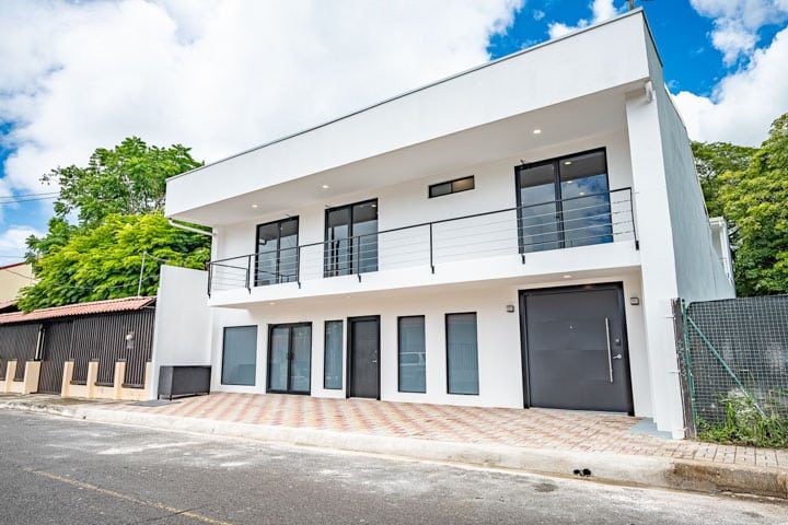 Casa VIP 5 — 13-bedroom beachfront villa in Jacó Beach, white villa street exterior