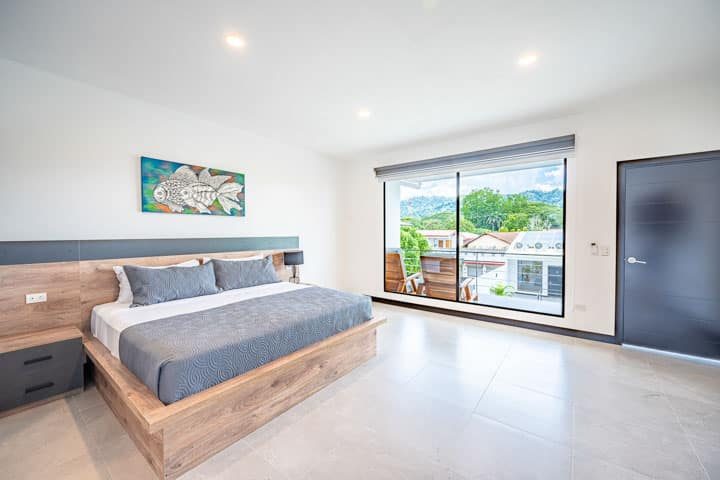 Casa VIP 5 — 13-bedroom beachfront villa in Jacó Beach, open-plan living room with glass doors