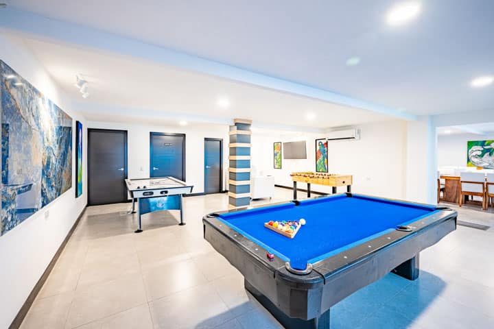 Casa VIP 5 — 13-bedroom beachfront villa in Jacó Beach, stone dining table and bar seating