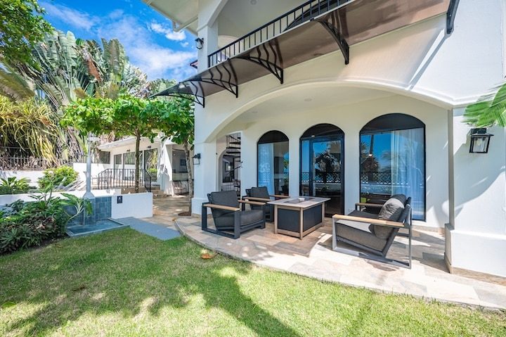 Casa VIP 6 — 11-bedroom beachfront villa in Jacó Beach, poolside deck with ocean beyond