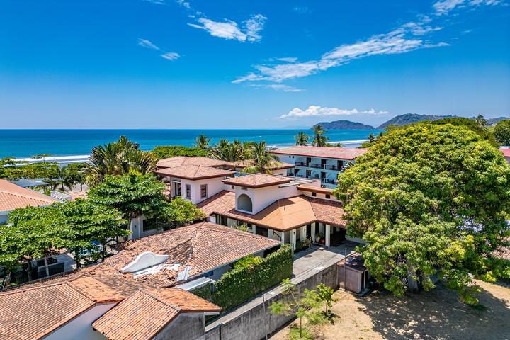 Casa VIP 7 — 9-bedroom beachfront villa in Jacó Beach, aerial view of the beachfront villa and Jacó Beach