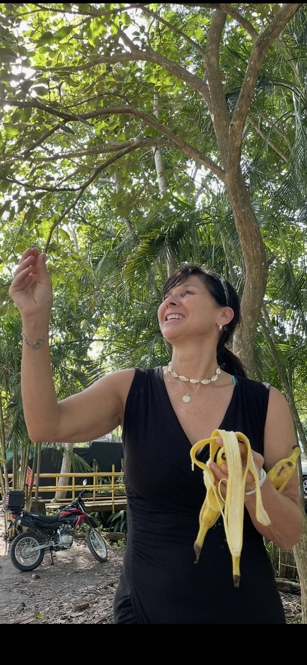 A happy guest with fresh local fruit in Jacó