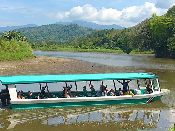 Tour boat cruising the Tárcoles River through the jungle
