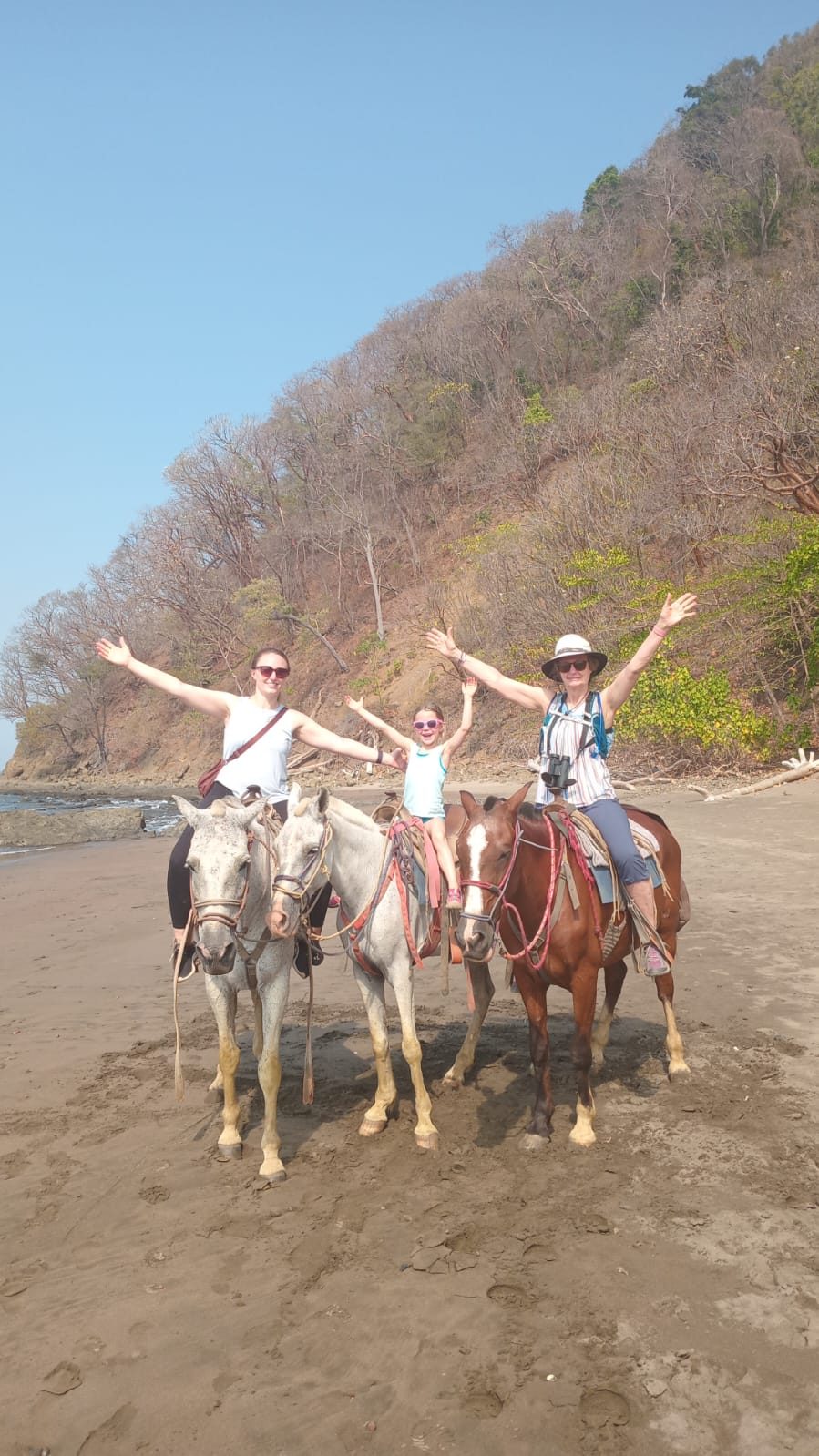 Group horseback ride on the sand in Costa Rica