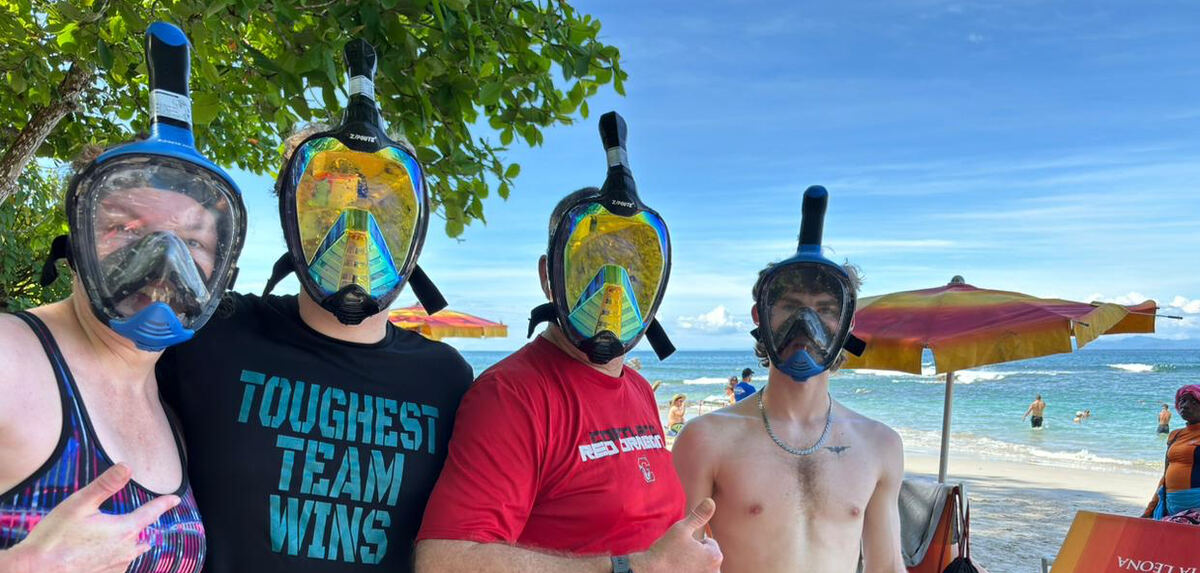 Group in snorkel masks ready to swim