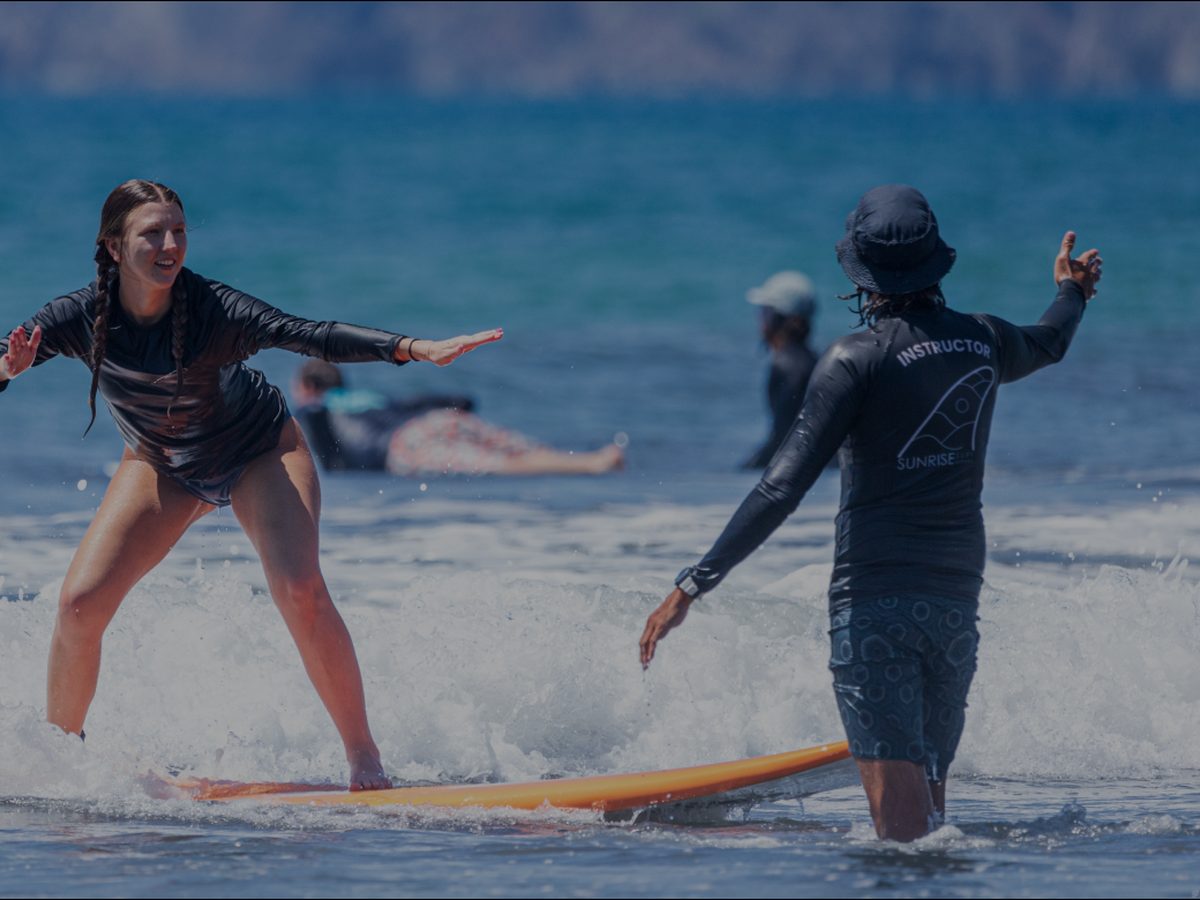 Beginner surf lesson on the beach in Jacó