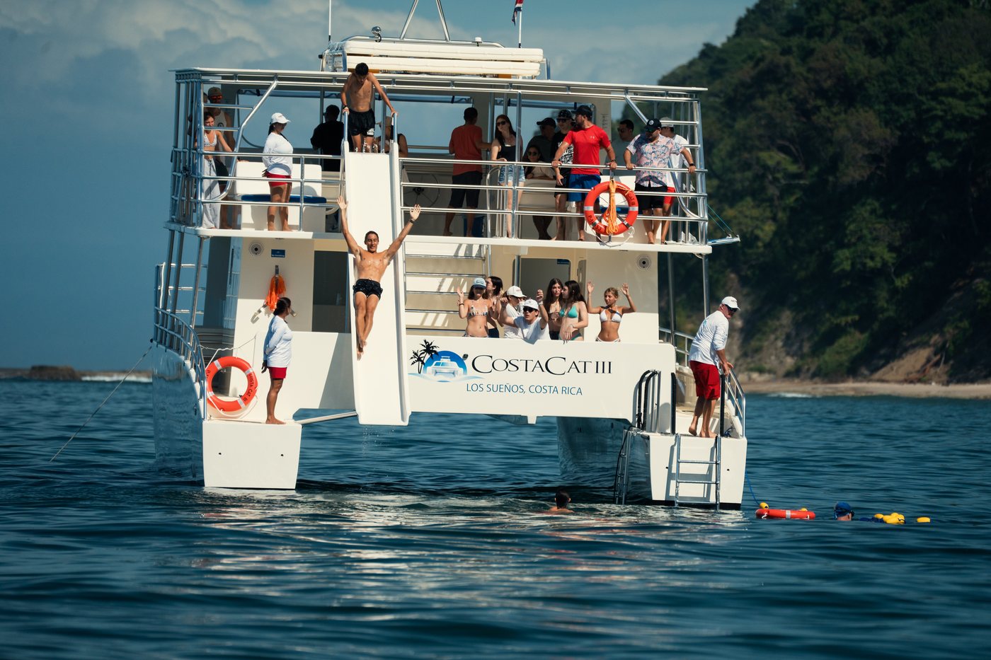 Guests aboard the catamaran anchored off Tortuga Island
